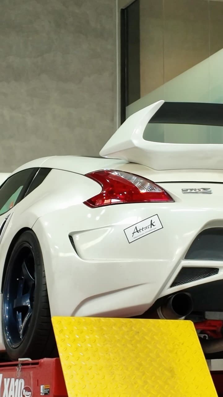 Nissan 370Z on the lift for preventive maintenance